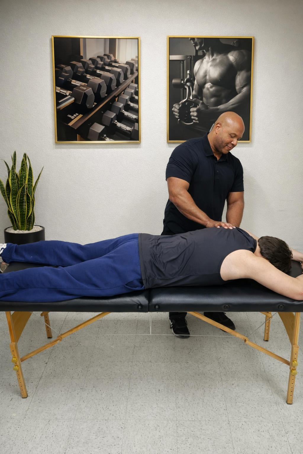 Chris Hughes performing hands-on corrective work on a client